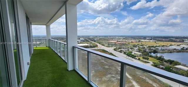 balcony featuring a water view