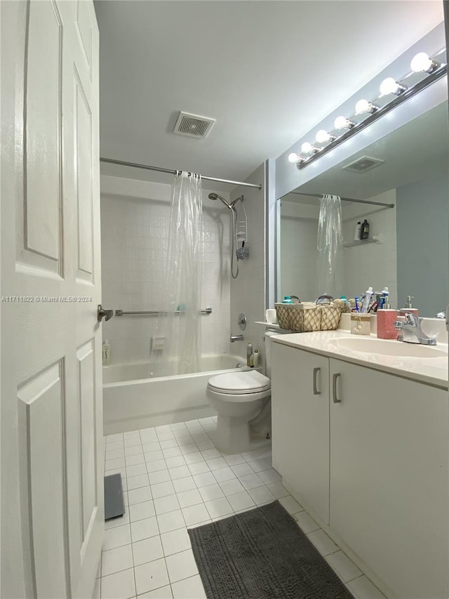 full bathroom with toilet, shower / bath combination with curtain, vanity, and tile patterned floors