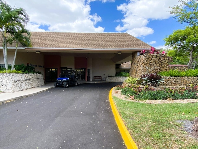 view of vehicle parking with a carport