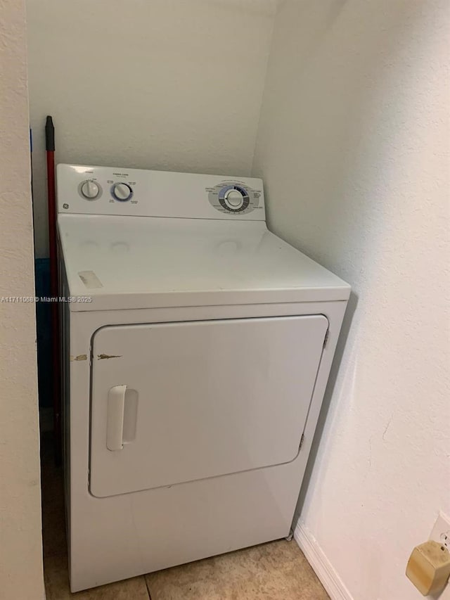 laundry room featuring washer / dryer and laundry area