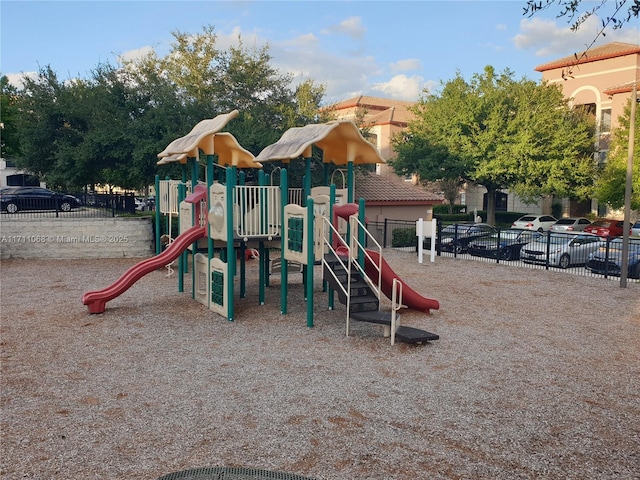 community jungle gym with fence