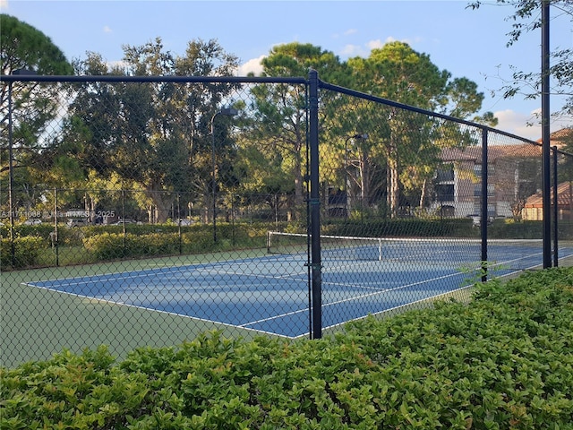 view of sport court with fence