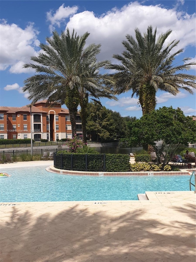 community pool with fence