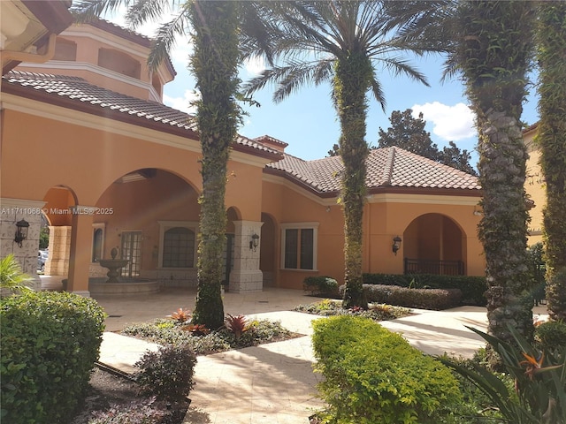 6169 Metrowest Blvd Unit 104, Orlando, FL 32835 - back of property with a tile roof and stucco siding