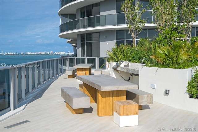 exterior space featuring a water view and exterior bar