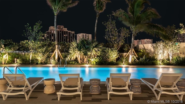 view of pool at night