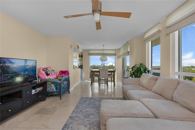 tiled living room with ceiling fan