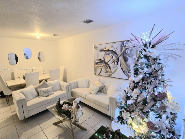 tiled living room with a textured ceiling