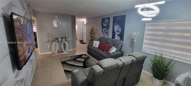 tiled living room with a chandelier