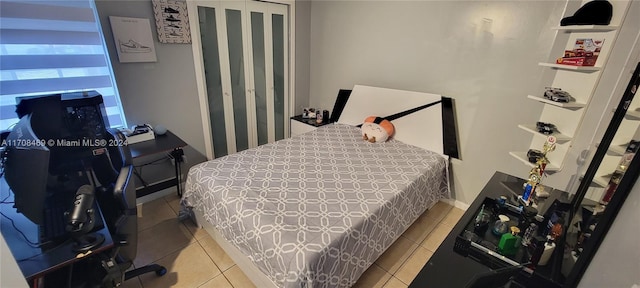 bedroom featuring light tile patterned floors