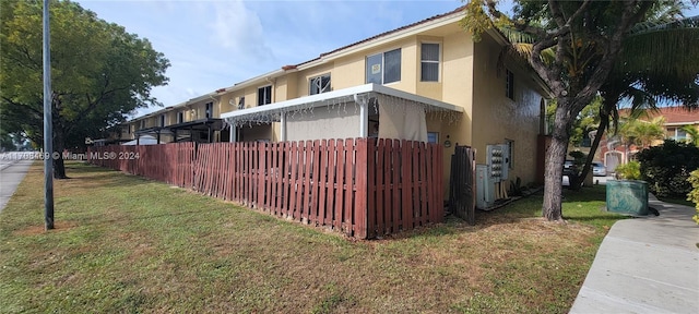 view of home's exterior with a lawn