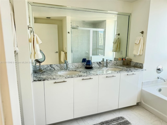 bathroom featuring vanity and shower with separate bathtub