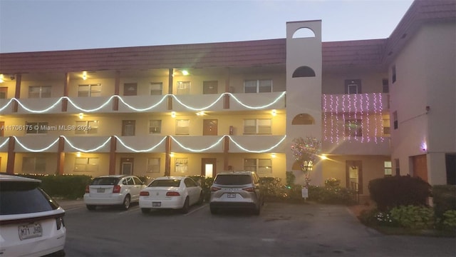 view of outdoor building at dusk