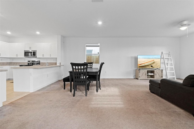 dining area with light carpet