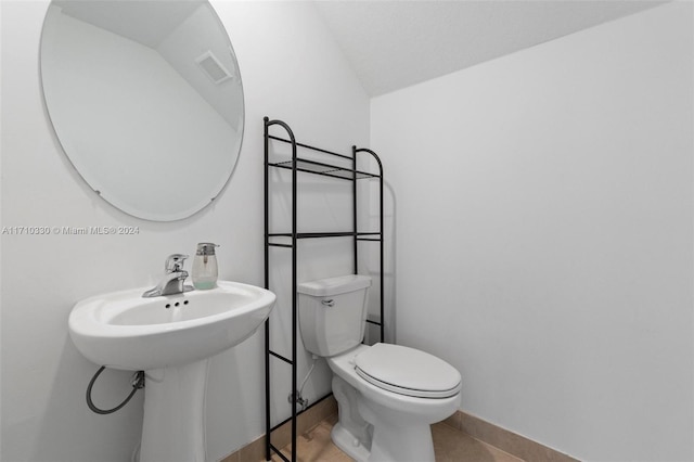 bathroom featuring sink and toilet