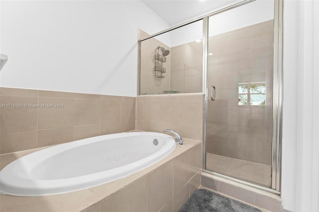 bathroom featuring plus walk in shower