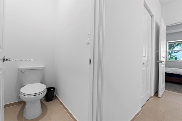 bathroom featuring tile patterned floors and toilet