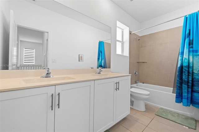 full bathroom featuring plenty of natural light, shower / bath combination with curtain, tile patterned floors, and toilet