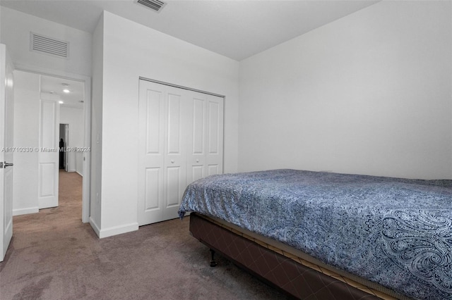 bedroom featuring a closet and carpet flooring