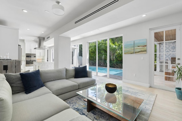 living room with light hardwood / wood-style floors