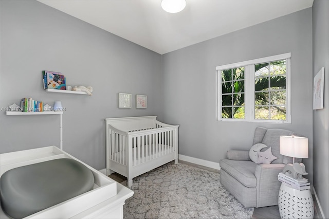 bedroom with a nursery area