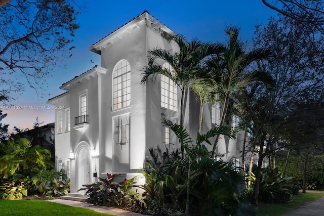 view of property exterior at dusk