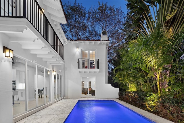 view of pool featuring a patio area