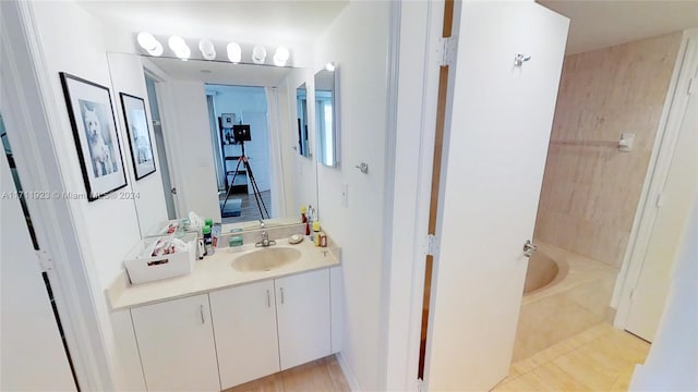 bathroom with vanity and a bathing tub