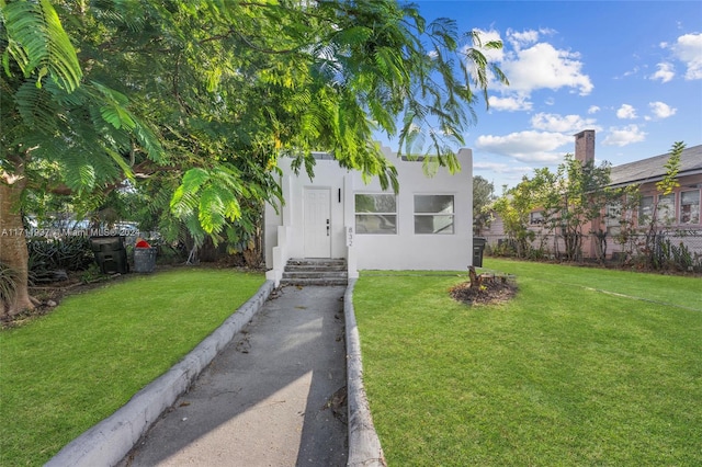 view of front of house with a front yard