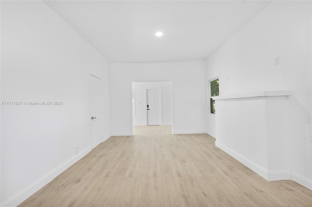 empty room with light hardwood / wood-style flooring