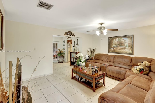 tiled living room with ceiling fan