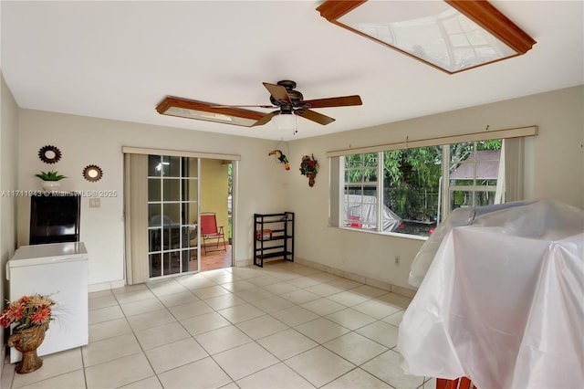 interior space featuring ceiling fan and light tile patterned flooring