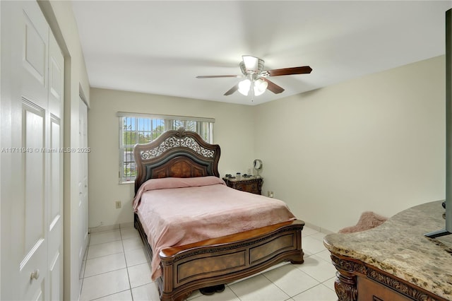 bedroom with light tile patterned floors and ceiling fan