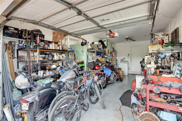 garage with washer / dryer, a garage door opener, and ceiling fan