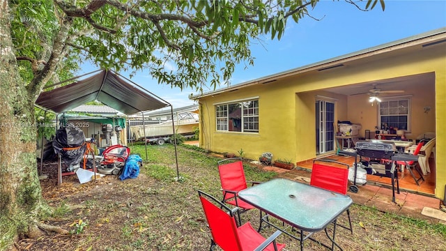 view of yard with ceiling fan