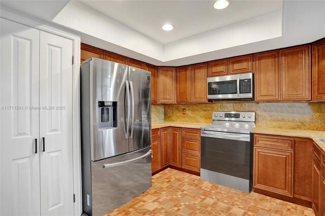 kitchen featuring backsplash and appliances with stainless steel finishes