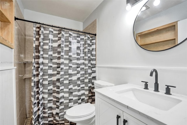 bathroom featuring a shower with shower curtain, vanity, and toilet