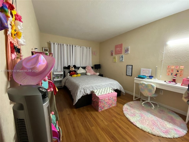 bedroom featuring hardwood / wood-style flooring