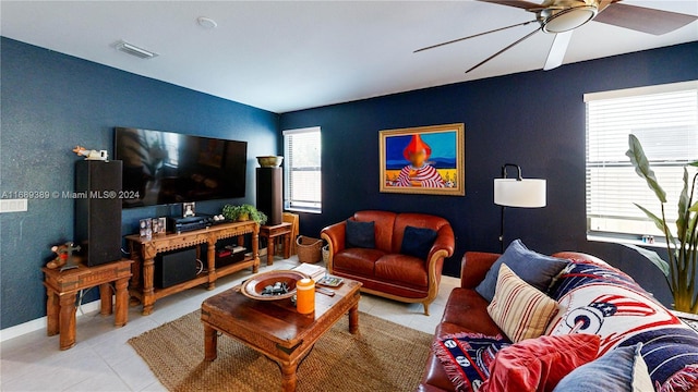 living room with ceiling fan and light tile patterned flooring