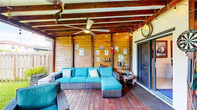 wooden terrace featuring ceiling fan