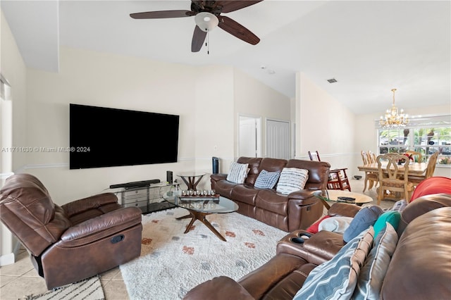 tiled living room featuring ceiling fan with notable chandelier and lofted ceiling