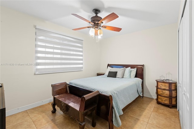 bedroom featuring ceiling fan and light tile patterned floors