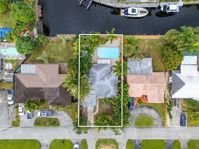 birds eye view of property with a water view