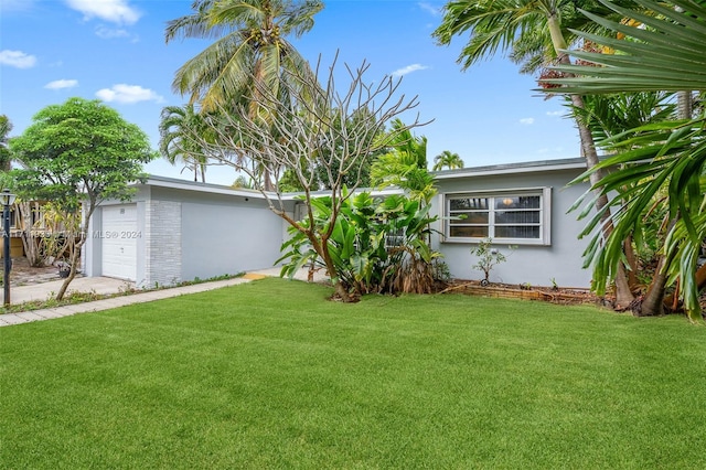 view of yard with a garage