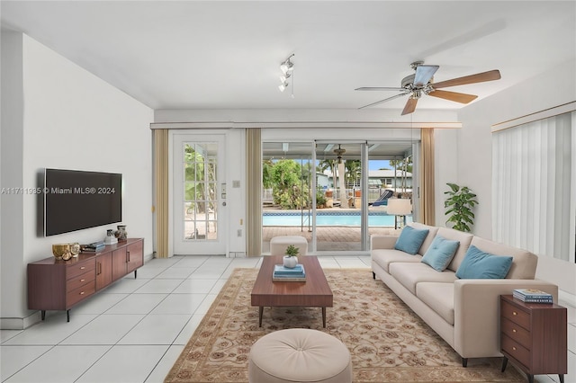 tiled living room featuring ceiling fan