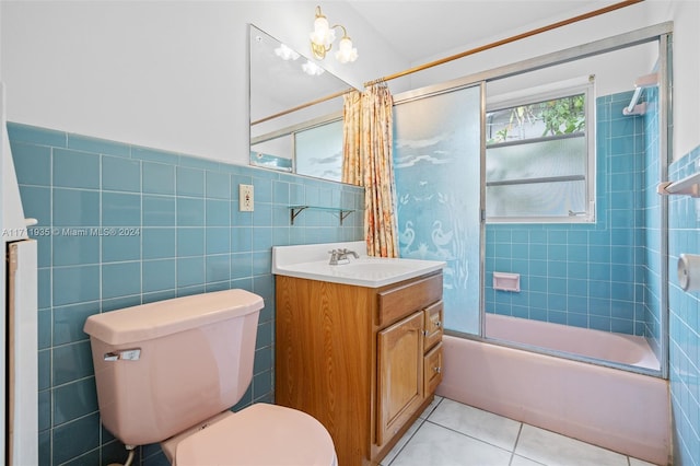 full bathroom with vanity, tile patterned flooring, toilet, shower / bath combo with shower curtain, and tile walls