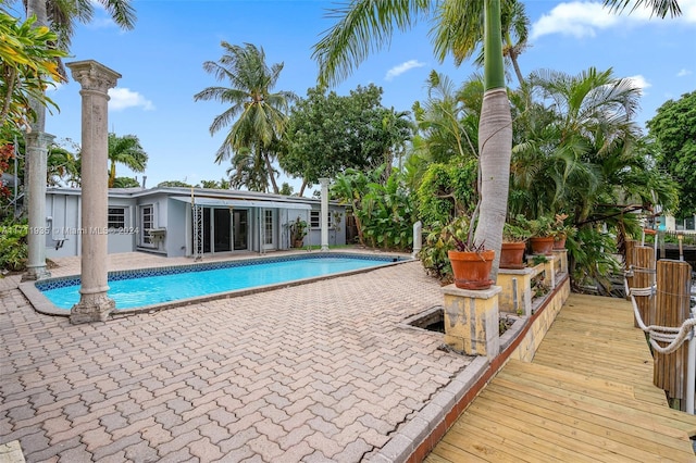 view of swimming pool with a patio area