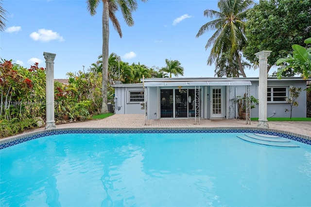 view of swimming pool with a patio area