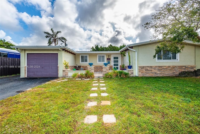 ranch-style house with a front lawn and a garage