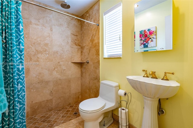 bathroom with toilet and curtained shower